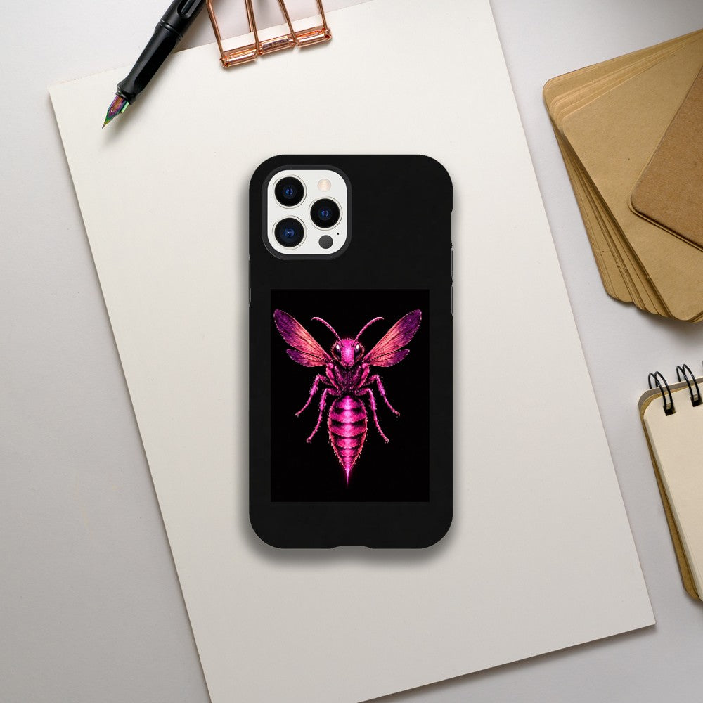 Phone case with a pink and purple insect design on a black background, placed on a white surface with stationery items.