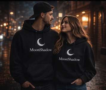 Two people wearing black hoodies with 'MoonShadow' logo against a blurred cityscape background