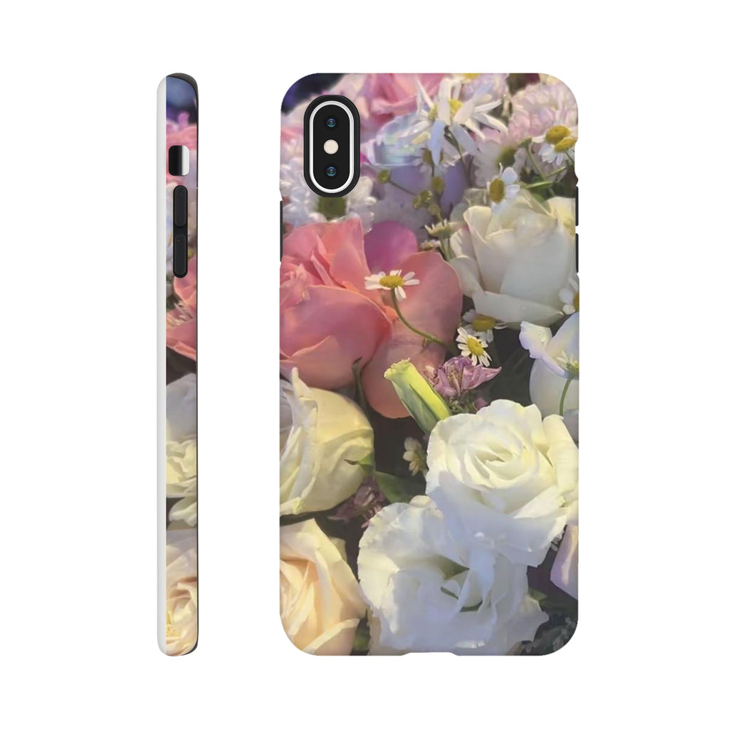 Phone case with a floral design featuring pink, white, and yellow flowers on a white background.