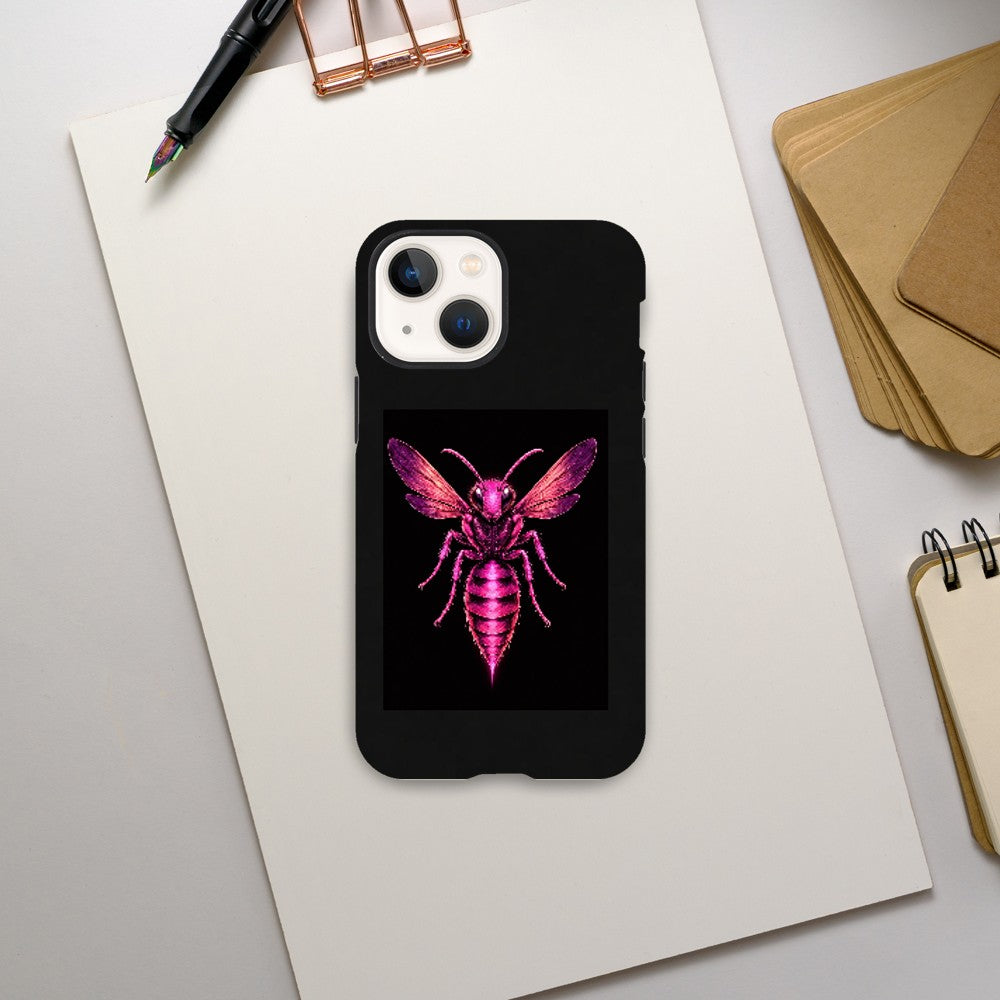 Phone case with pink bee design on a desk with stationery items