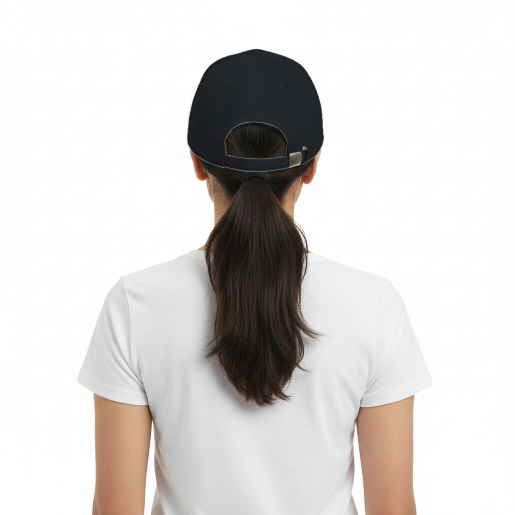 Person wearing a black cap and white shirt on a white background