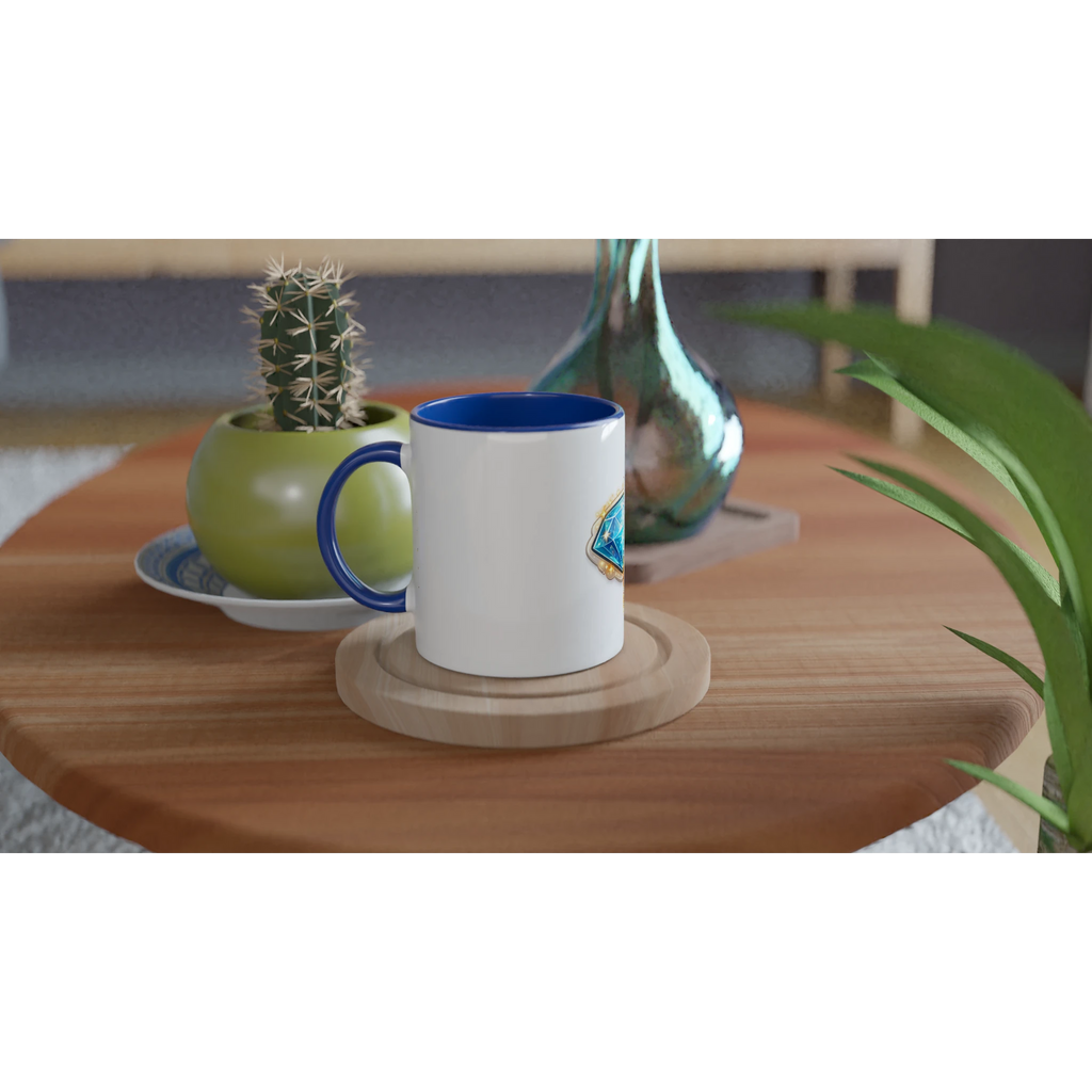 White mug with blue interior on a wooden table with a cactus and decorative vase.