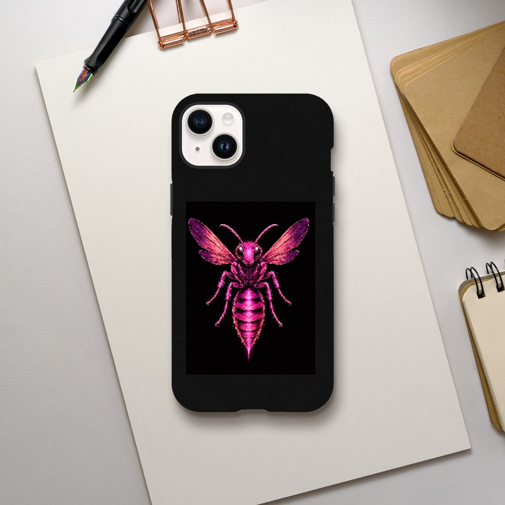 Black phone case with a pink insect design on a white surface with stationery items.