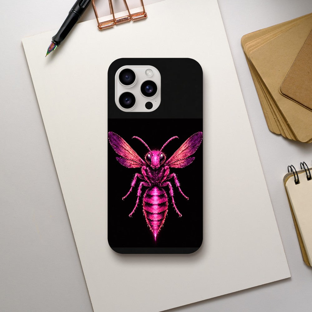 Phone case with a pink insect design on a black background, placed on a white surface with stationery items.