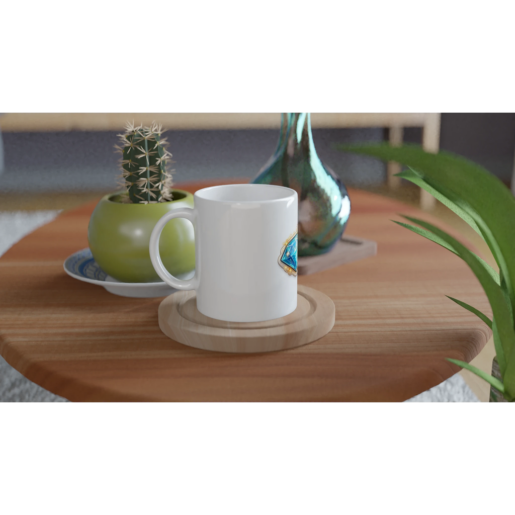 White mug on a wooden table with a cactus and decorative items.