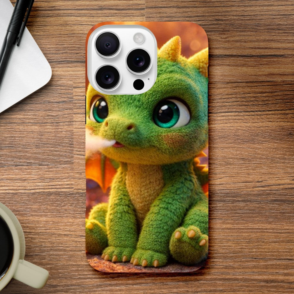 Phone case with a green dragon design on a wooden surface with a coffee mug and notebook.