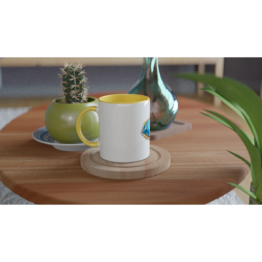 White mug with yellow interior on a wooden table with a cactus and decorative items.